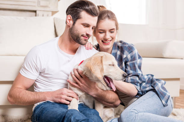 istock Young couple with puppy 671200178