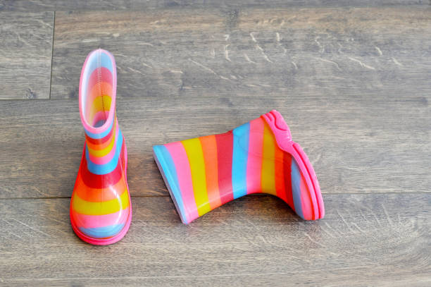 istock Pair of colorful boots on the floor 671205778