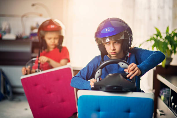 istock Brother and sister playing car racing indoors 671207930
