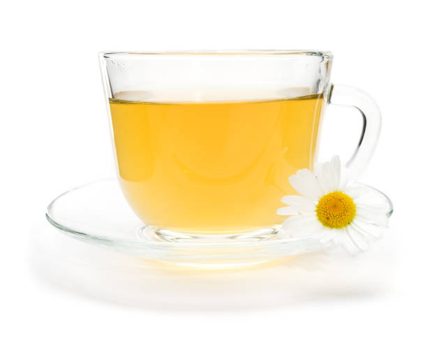 istock Camomile tea with chamomile flower isolated on white 671207986