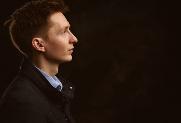 istock profile portrait of a handsome young man 671210586