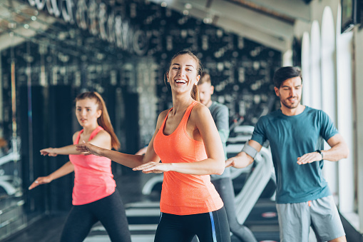 Small group of people exercising in the gym