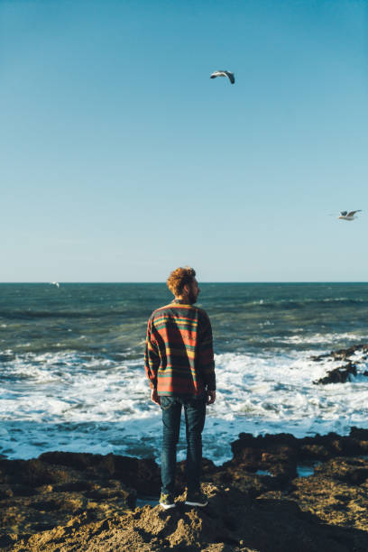 istock Man standing near the sea in Morocco 671212014