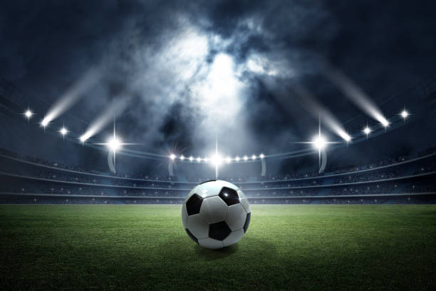 soccer ball in the stadium - bola de noite imagens e fotografias de stock
