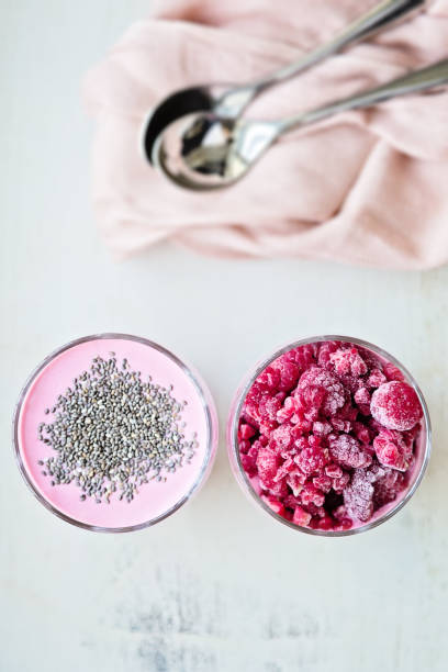 istock Chia raspberies cottage cheese breakfast in two small transparent glasses 671217922