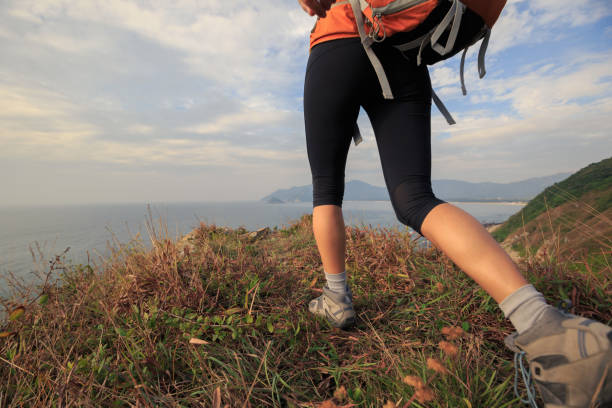 istock successful woman hiker hiking on mountain peak 671218214