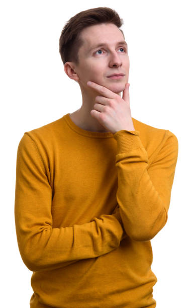 istock casual young man thinking and looking up 671220812