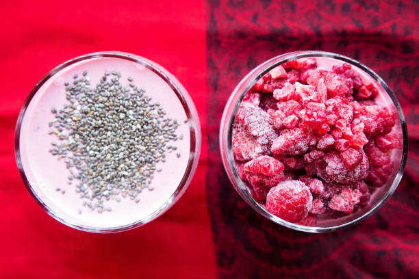 istock Chia raspberies cottage cheese breakfast in two small transparent glasses 671221706
