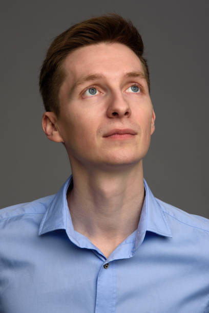 istock portrait of a young man looking up 671222204