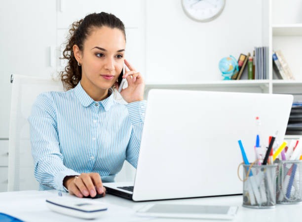 istock Business lady with smart phone and laptop 671227900