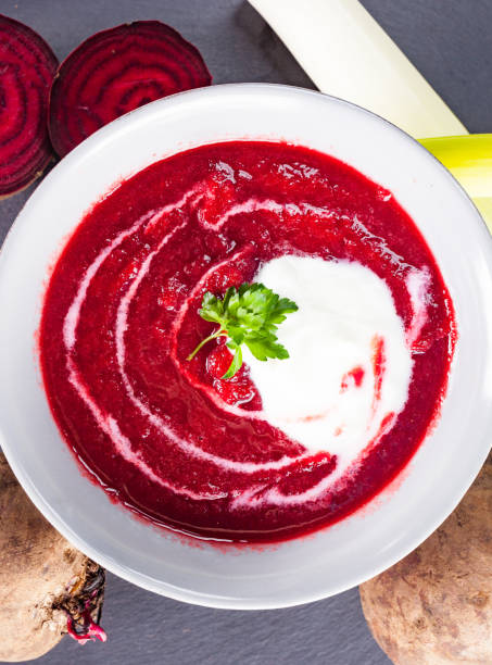 Beetroot, red borscht with sour cream and parsley