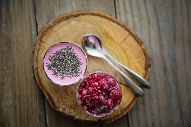 istock Chia raspberies cottage cheese breakfast in two small transparent glasses 671228596