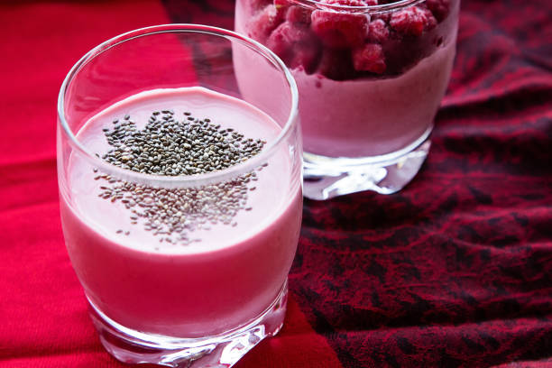 Chia raspberies cottage cheese breakfast in two small transparent glasses