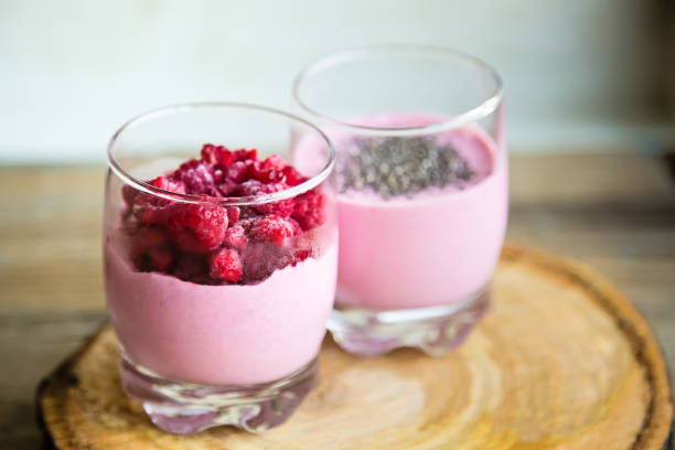 istock Chia raspberies cottage cheese breakfast in two small transparent glasses 671231930
