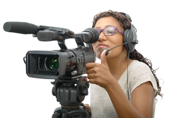 istock young African American women with professional video camera 671234702