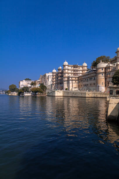 An External view of City Palace from Lake Pichola - Udaipur An External view of City Palace from Lake Pichola - Udaipur ; An External view of City Palace Udaipur, it is a most visited tourist attraction of Udaipur in Rajasthan, Built over a period of nearly 400 years, with contributions from several rulers of the Mewar dynasty. udaipur stock pictures, royalty-free photos & images