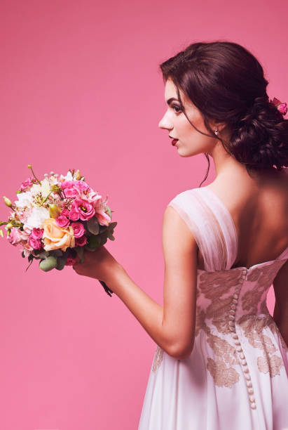 istock Brunet bride portrait in pink studio 671235426