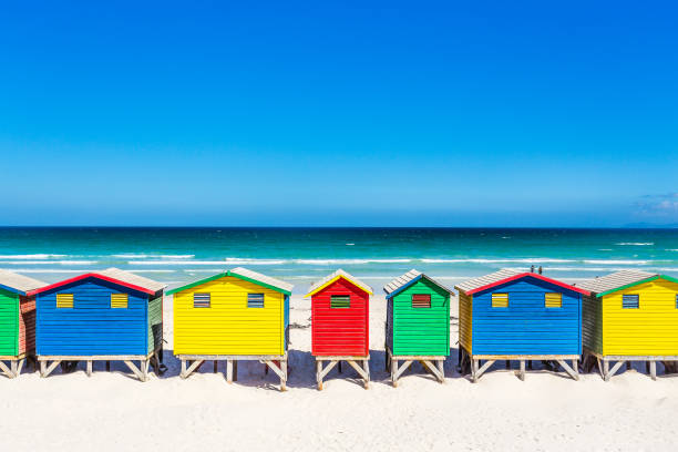 istock Colorful shacks in Muizenberg Beach 671236384