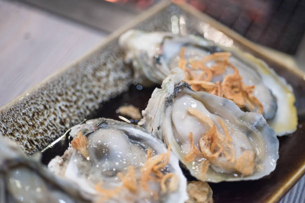 istock Close up of fresh Oysters on dish 671236548