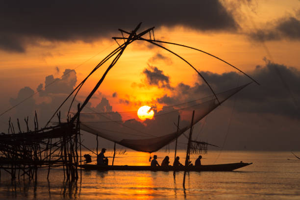 istock Sunset at river with Fish trap for travel 671243032