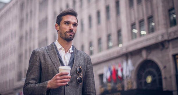 istock Handsome businessman with coffee to go 671243100