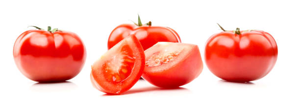 istock Fresh juicy tomatoes, cutting in half and a slice 671247008