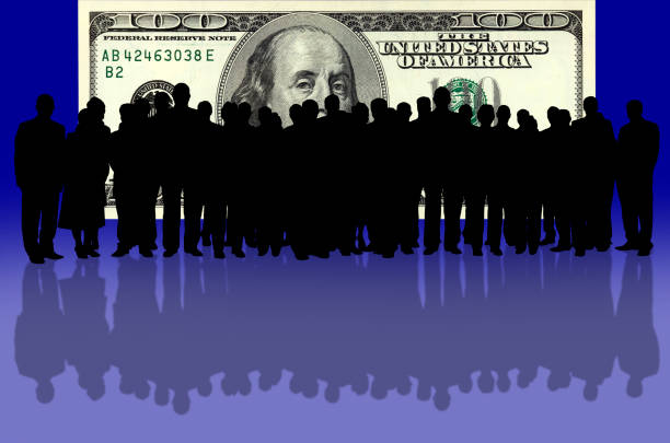 conceptual image of 100 dollar bill and business people silhouette
