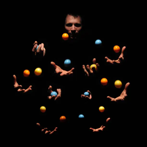 Talented man juggling with color balls. Successful concept. Caucasian performer show exhibition.