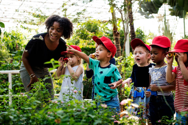 Teacher and kids school learning ecology gardening Teacher and kids school learning ecology gardening plant nursery photos stock pictures, royalty-free photos & images