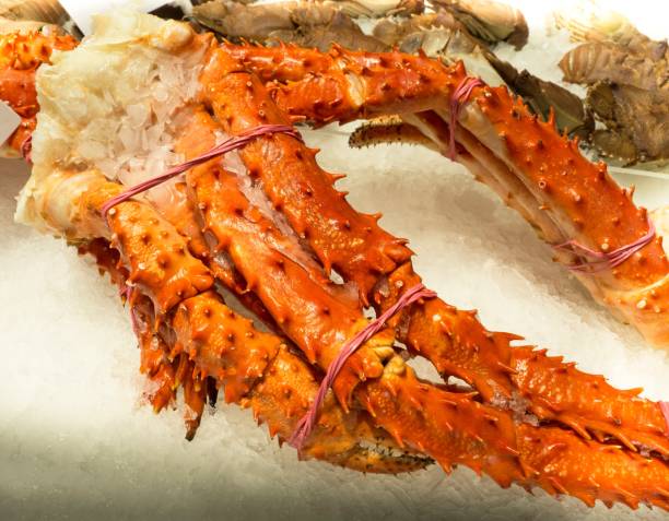 istock Raw Seafood : Jumbo Alaskan Crab Legs On Ice 671254576