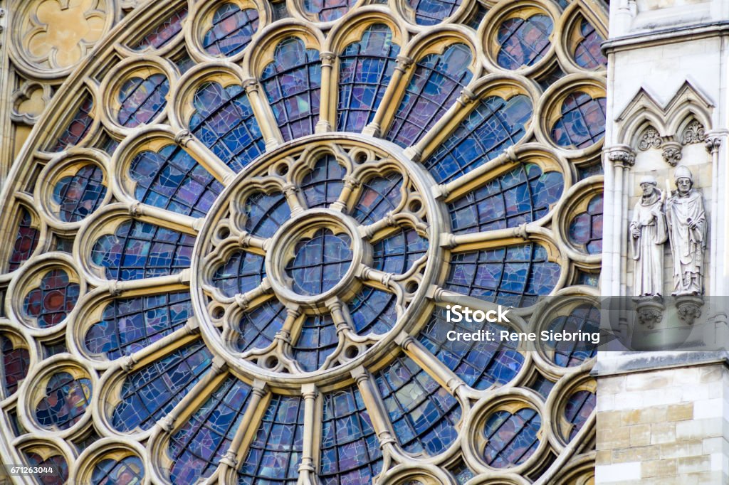 Close up of one of the stained glass windows of Westminster Abbey A round stained glass window in the Westminster Abbey. Westminster Abbey Stock Photo