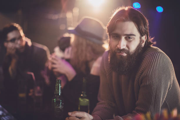 istock Bearded hipster in the bar with friends 671264888