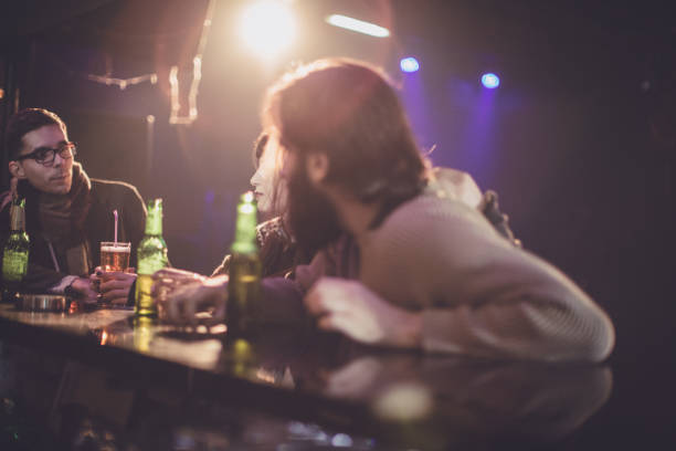 drinking with friends - after work beautiful people beer beer bottle imagens e fotografias de stock