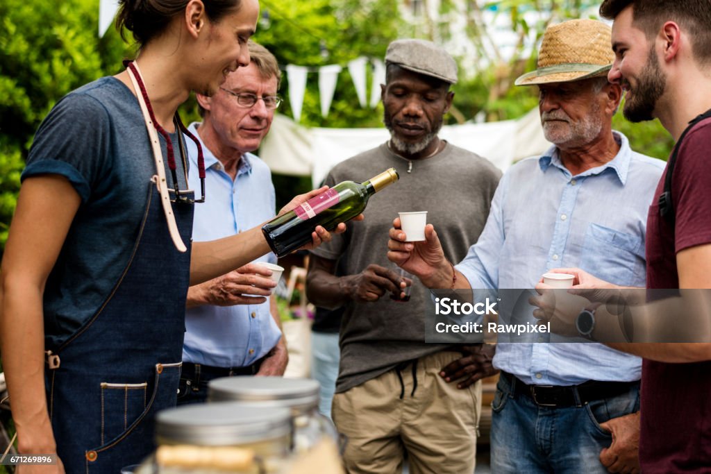 Group of men drinking local red wine together Wine Stock Photo