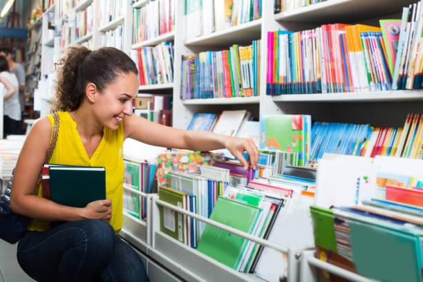 istock young woman in book shop 671270864