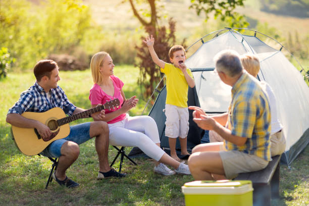 istock child singing with family 671273692