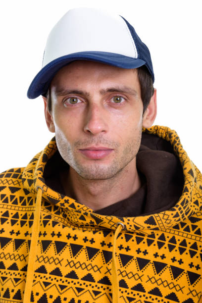 Face of young handsome man wearing cap vertical shot