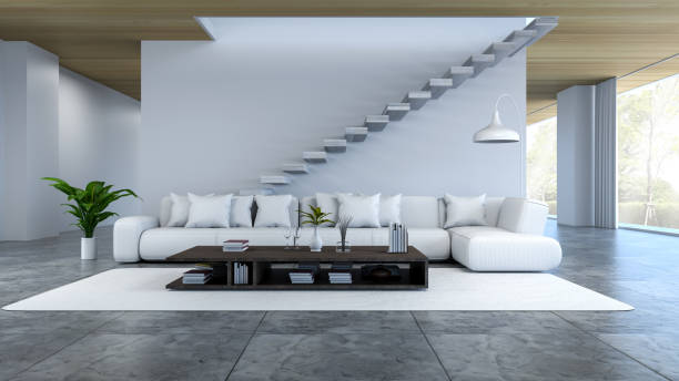 istock White room interior, white sofa and wood table on concrete floor white white wall /3d render 671281544
