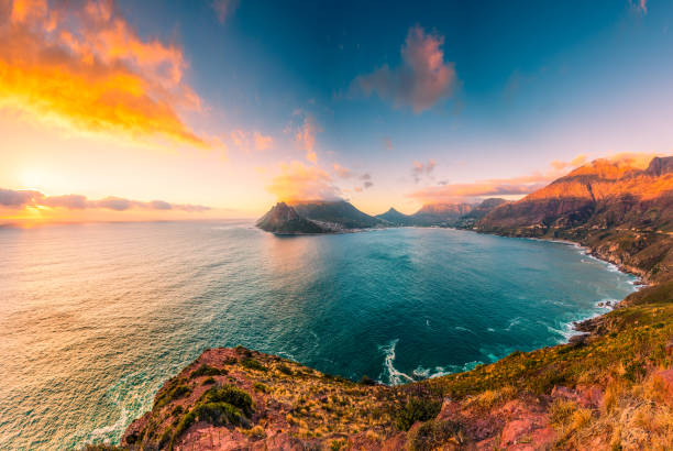Hout Bay from Chapman's Peak Drive This picture feature Hout Bay as seen from Chapman's Peak Drive at the late afternoon in a somewhat cloudy day. chapmans peak drive stock pictures, royalty-free photos & images