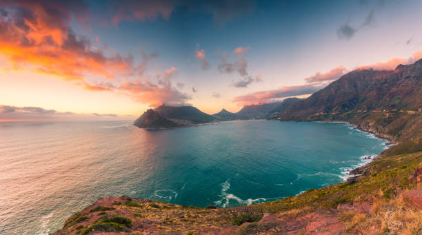 Hout Bay from Chapman's Peak Drive This picture feature Hout Bay as seen from Chapman's Peak Drive at the late afternoon in a somewhat cloudy day. chapmans peak drive stock pictures, royalty-free photos & images