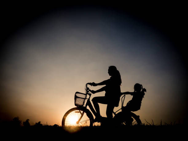 istock Biker family silhouette father and daughter 671287554