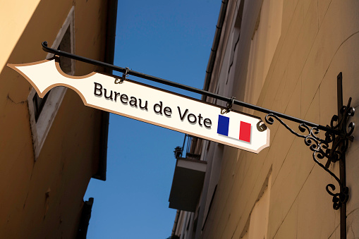 Directional street sign.  Presidential, parliamentary election day concept. Direction to the polling place. Polling place written in french.French  elections.2017