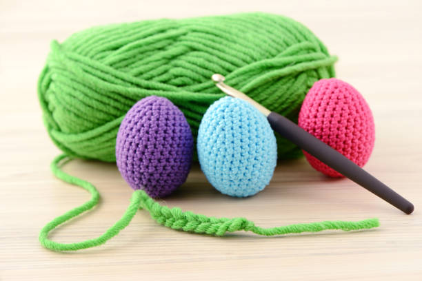 crocheting easter eggs in green, pink, blue and purple