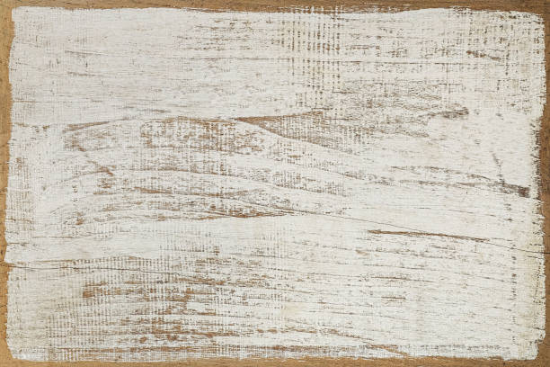 istock Distressed white wooden grained background with worn edges. 671295174