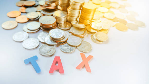 istock Thai Baht Coins background with text 'TAX' 671295502