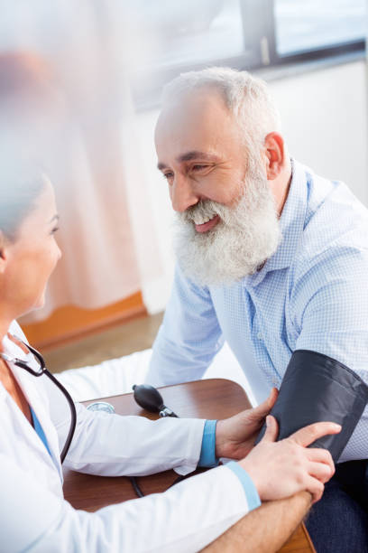 istock Doctor measuring pressure of patient 671299112