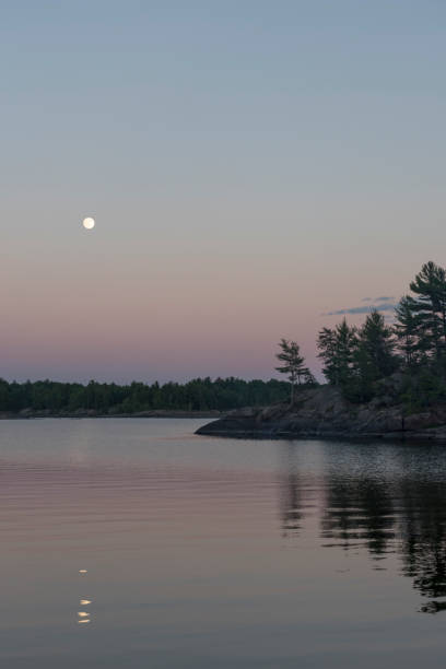 istock Moonrise Over the French River 671317388