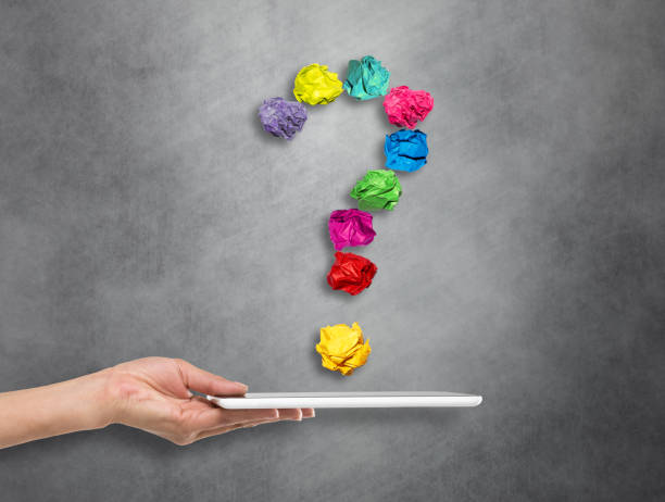 istock Hand holding digital tablet with crumpled question mark symbol 671324132