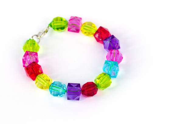Colorful kid bracelet isolated on white background, close-up