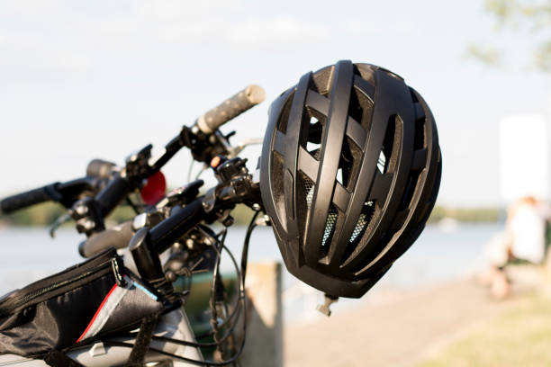Black helmet on a bicycle Black helmet on a bicycle cycling helmet photos stock pictures, royalty-free photos & images